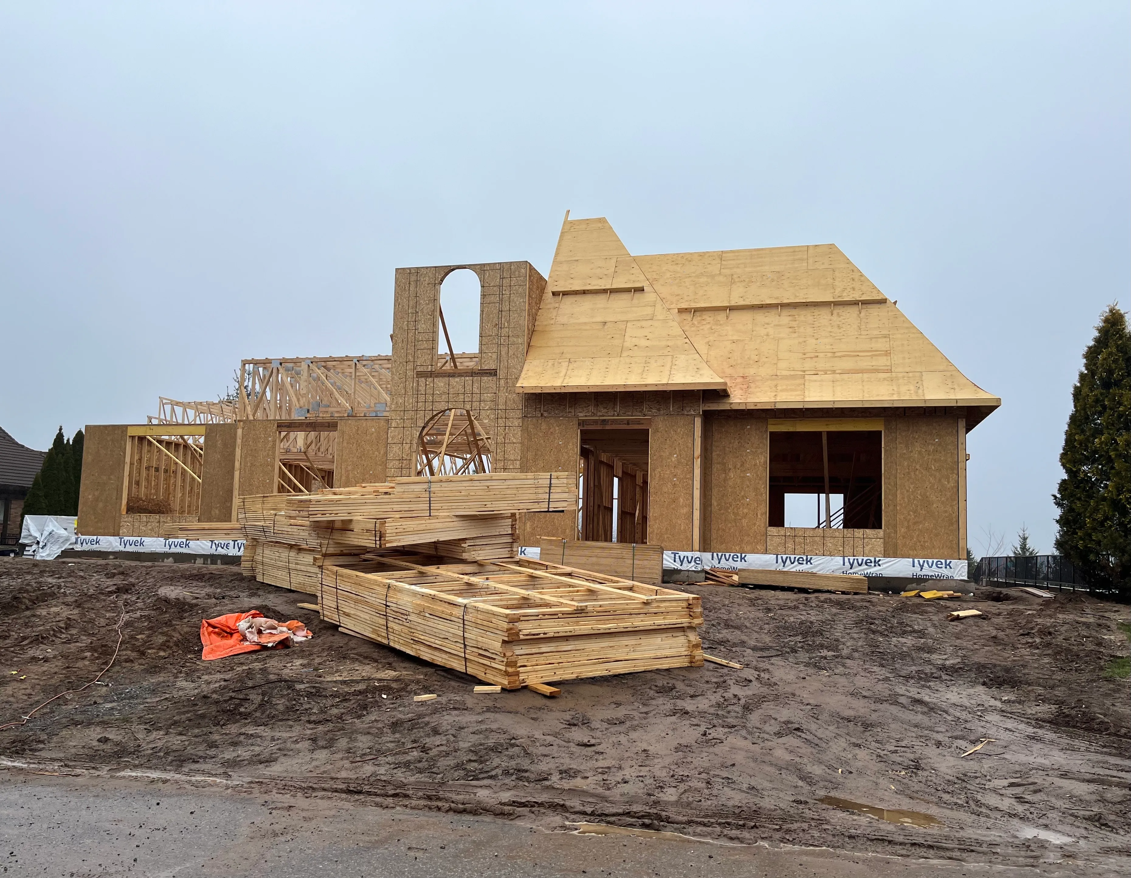 Timber roof framing and sheathing on a home under construction